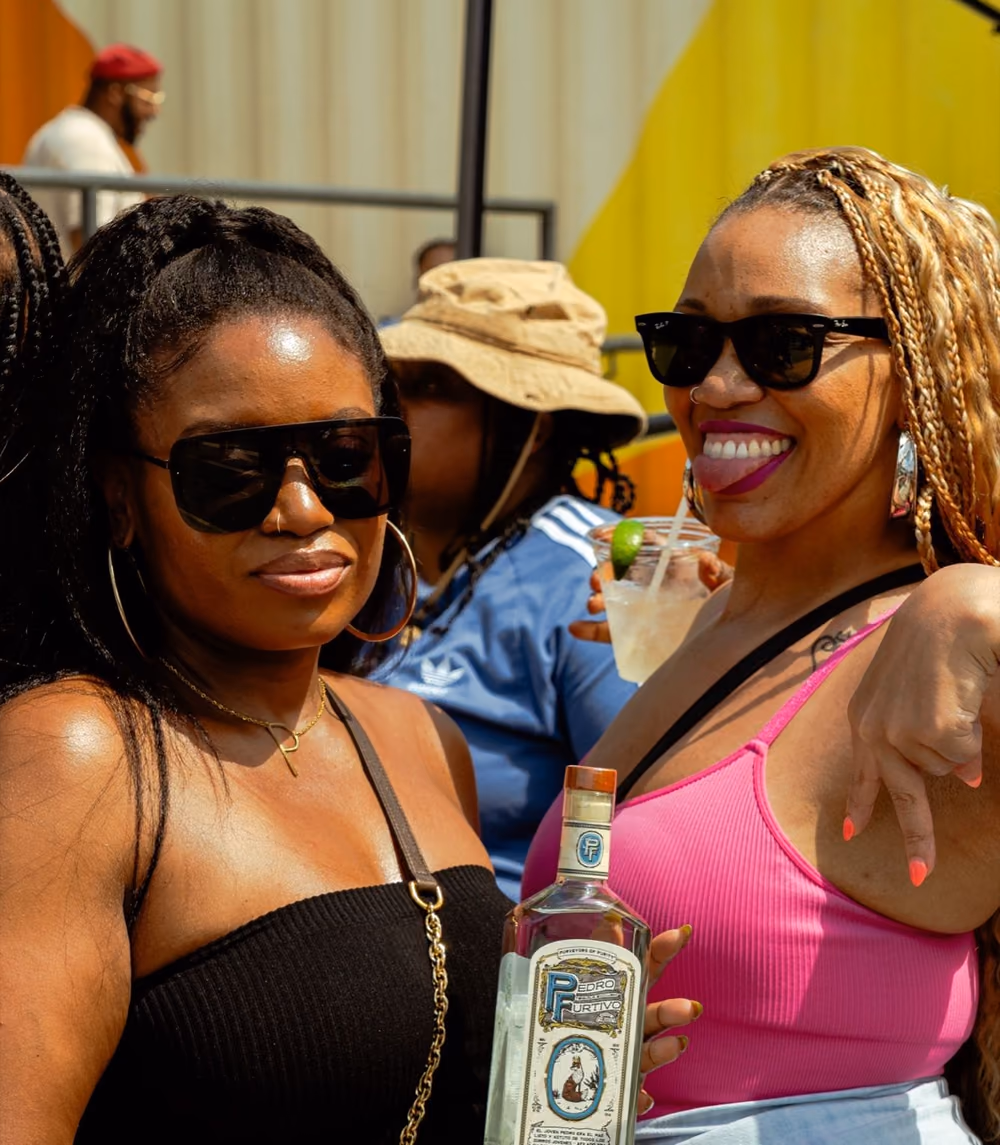 Friends laughing together at a festival