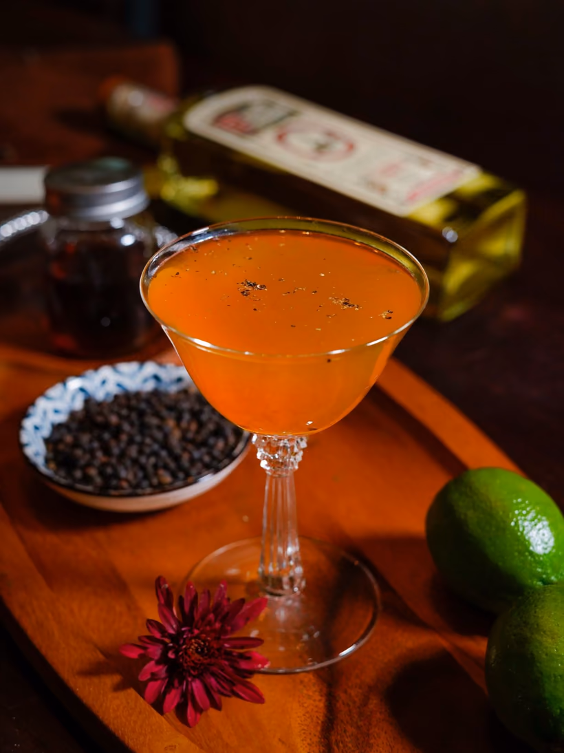 Paco’s Pimiento Dulce in a coupe with black peppercorns