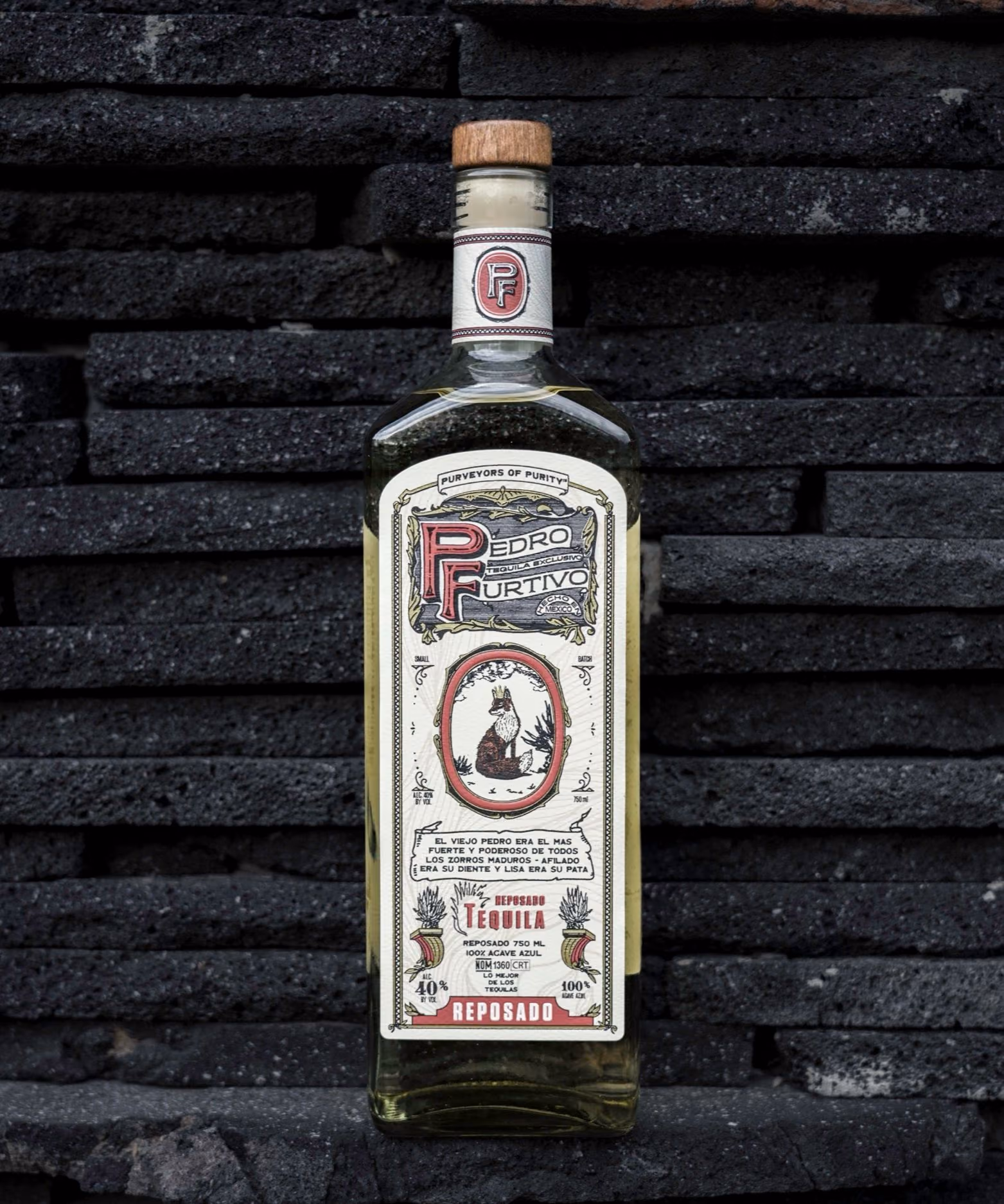 A second photograph of Pedro Furtivo Reposado, not its back label: the bottle against a black stone wall