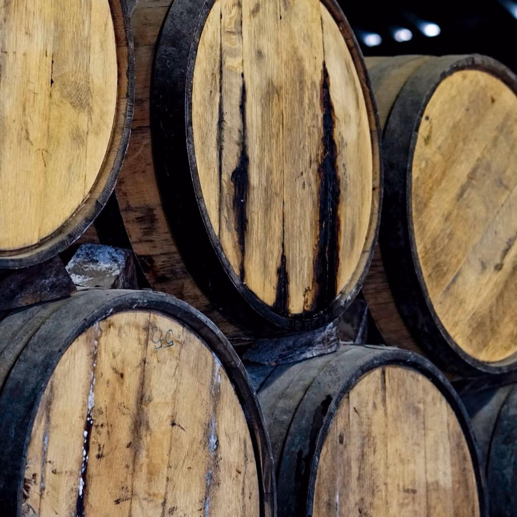 Rows of barrels stacked in the aging room